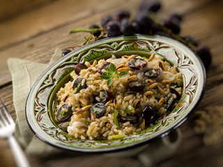 risotto with mushroom grape and pine cone, selective focus