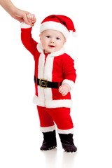 first steps of cute baby Santa claus