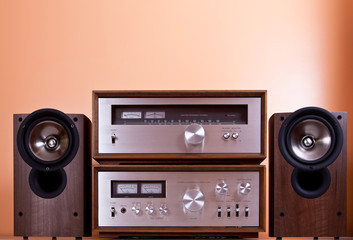 Vintage hi-fi Stereo Amplifier tuner and speakers in wooden cabi
