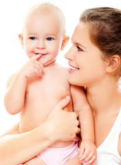 Young mother hugging baby