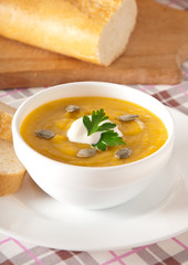 Cream of pumpkin soup with sour cream sauce 
