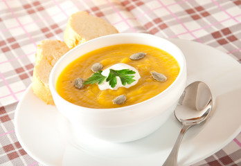 Cream of pumpkin soup with sour cream sauce 