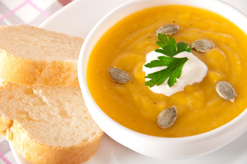 Cream of pumpkin soup with sour cream sauce 