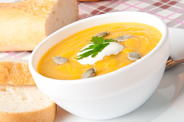 Cream of pumpkin soup with sour cream sauce 