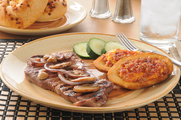 Steak with sauteed mushrooms and onions