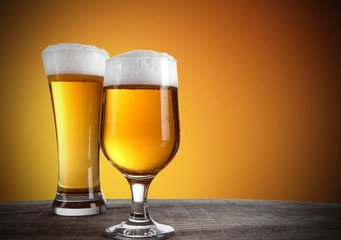 Beer glasses with gold background