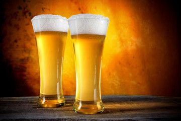 Beer glasses with gold background
