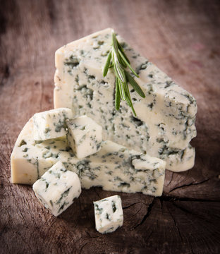 Blue cheese on wooden background