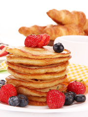 Small pancakes topped with honey