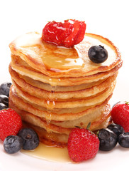 Small pancakes topped with honey