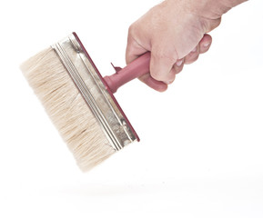 hand with a brush isolated on white background