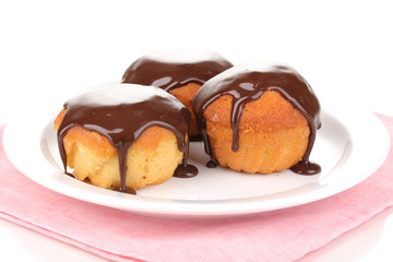 Appetizing cupcakes with chocolate isolated on white