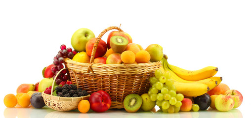 Assortment of exotic fruits and berries in baskets isolated