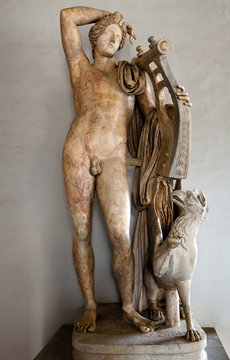 Ancient Roman statue of Apollo holding a lyre