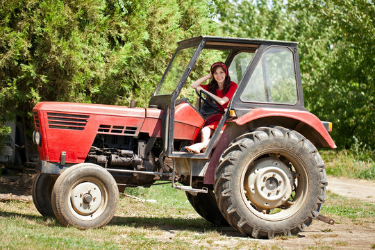 Young country girl on tractor