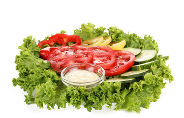 Chopped vegetables and sauce on plate isolated on white