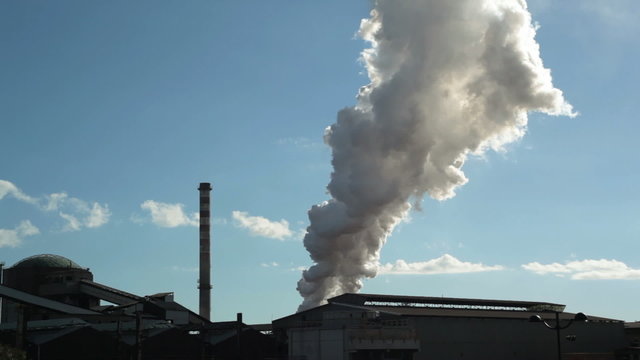 Water vapor column rising up from factory