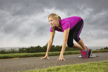 Fit Middle-Aged Female Ready to Sprint