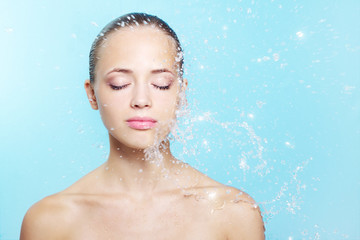 Beautiful girl and stream of water