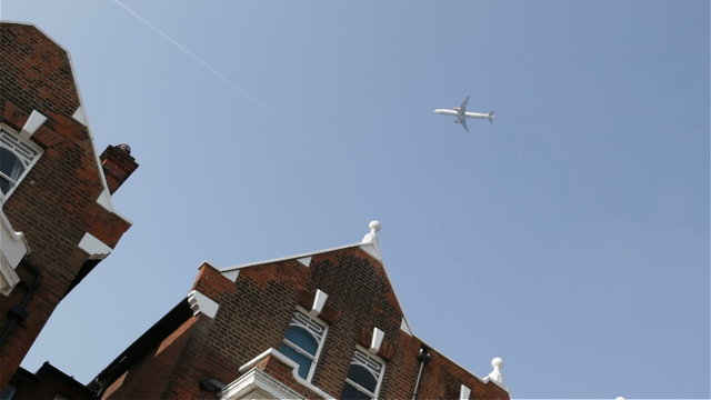 Plane flying over houses in London