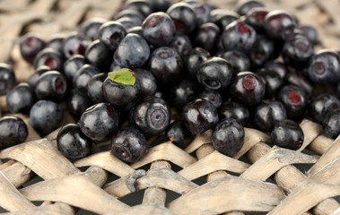 Fresh blueberries on wicker mat close-up