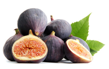 Ripe sweet figs with leaves isolated on white