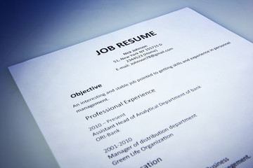 Closeup of resume on blue background