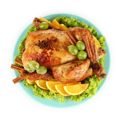 whole roasted chicken with lettuce, grapes, oranges and spices