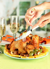 Cutting baked chicken close-up. Thanksgiving Day