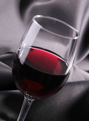red wineglass on silk