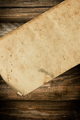 Faded paper roll on a dark wooden background