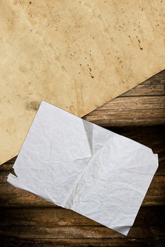 Crumpled old papers on a wooden background