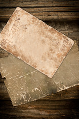 Faded old papers on a wooden background