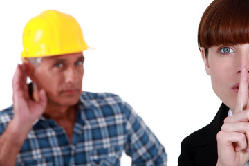 Woman telling builder to be quiet