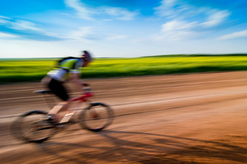 man biking in motion