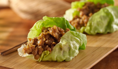 Asian lettuce wrap with minced chicken and seasonings - obrazy, fototapety, plakaty
