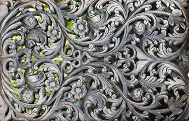 Pattern of flower carved on wood background