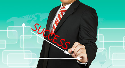 Businessman drawing a graph with Success going down