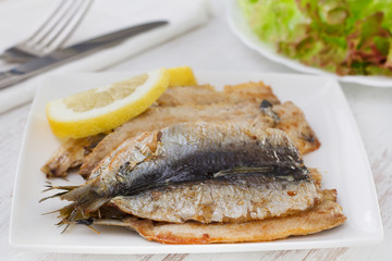 fried fillet of sardines with lemon