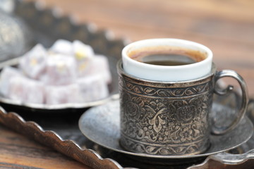Turkish coffee and turkish delight with traditional cup and tray