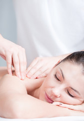 Fototapeta na wymiar Close-up portrait of relaxing woman having massage