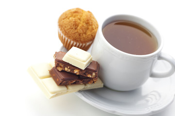 bar of chocolate,tea and muffin isolated on white