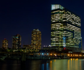 Obraz na płótnie Canvas Night in financial district of a big city