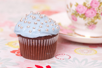 blue cup cake with tea cup