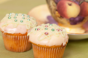 two green cup cakes