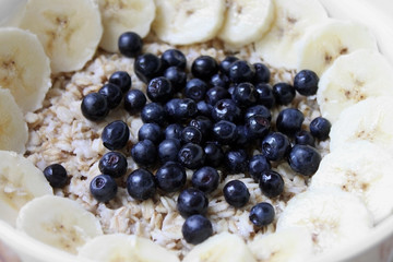 oatmeal porridge with bananas and bilberries