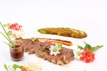Beefsteak decorate with edible flowers, (Thai food Style) 
