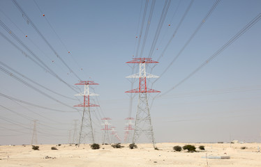 High voltage towers in the desert of Qatar, Middle East