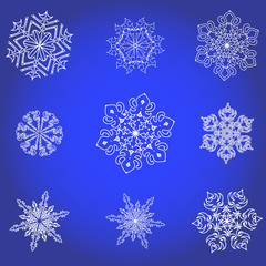 Set of white snowflakes on a dark blue background.