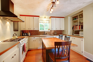 Craft cozy White kitchen with grey walls and hardwood floor.